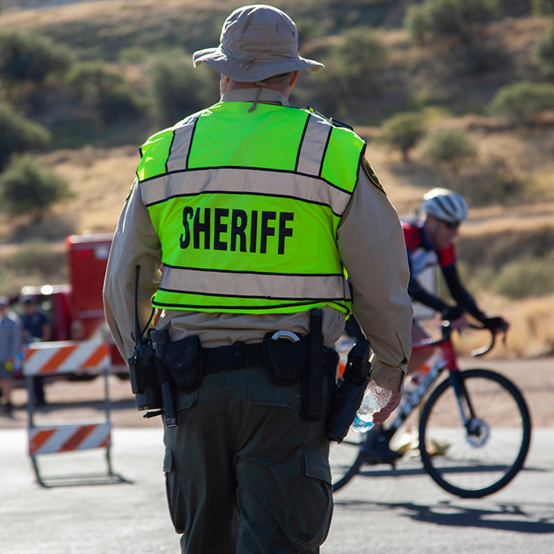 reserve deputy helping manage traffic during a bike benefit